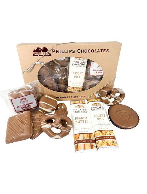 Chocolate Survival Kit by Phillips Chocolate featuring a delicious assortment of chocolate bars, chocolate-covered graham crackers, Oreo, s’mores, peanut butter cup, chocolate lobster, and chocolate-covered pretzels.