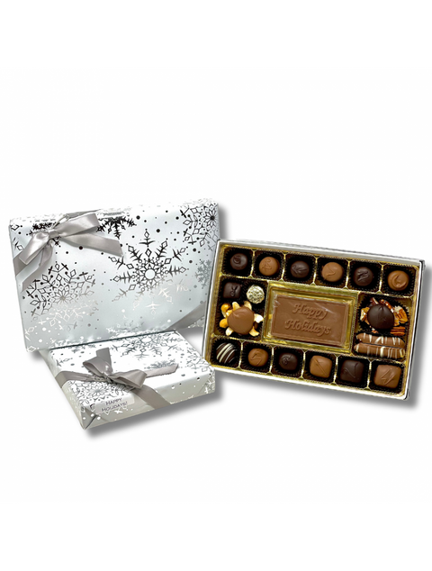 Happy Holidays Celebration Box featuring an assortment of handmade chocolates and a milk chocolate plaque with 'Happy Holidays' inscription, ideal gift for the festive season.