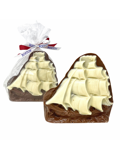 Chocolate Tall Ship from Phillips Chocolate, a handcrafted milk and white chocolate confection embellished with a Boston themed ribbon, perfect as a souvenir.