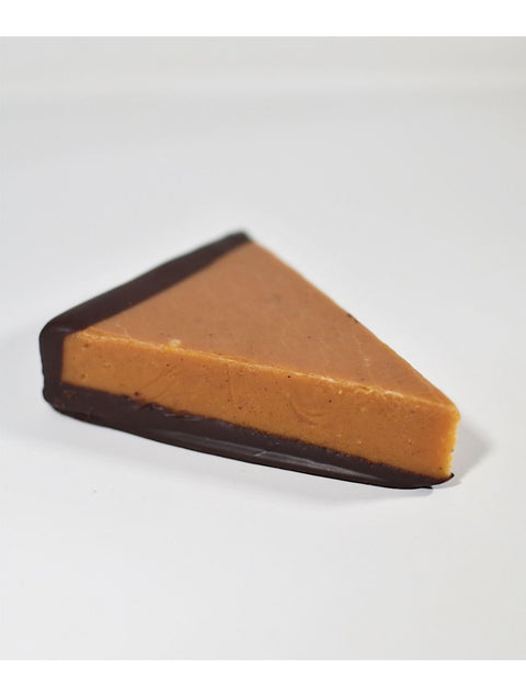 Delicious Pumpkin Pie Fudge Slice by Phillips Chocolate, a fall treat featuring creamy pumpkin fudge dipped in rich dark chocolate.