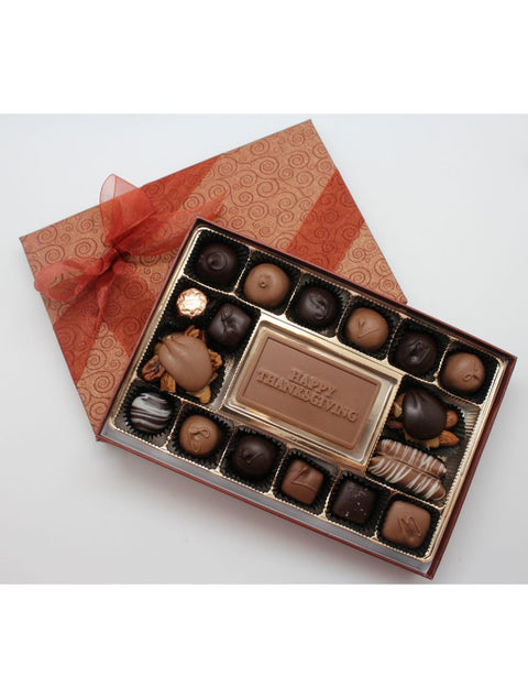Thanksgiving Celebration Box featuring a delightful assortment of milk and dark chocolates with a festive Happy Thanksgiving plaque.