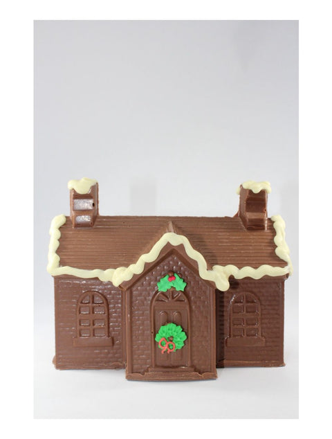 Cape House with two chimneys, designed by Phillips Chocolate, showcasing a charming coastal aesthetic.