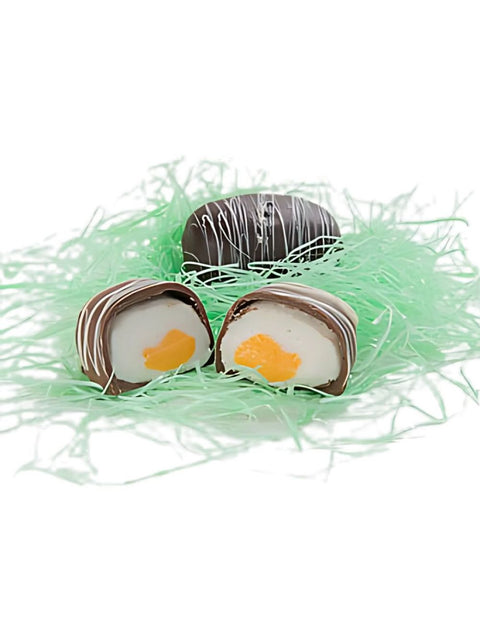 LARGE DARK YOLK EGG - A festive dark chocolate egg with a creamy vanilla center dyed yellow for a realistic yolk look.